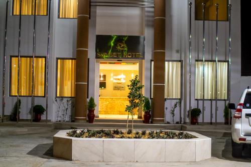 a large fountain in front of a building at SUNSET HOTEL in Nouakchott