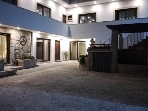 an empty courtyard of a building at night at RURAL HOUSE in Guifões
