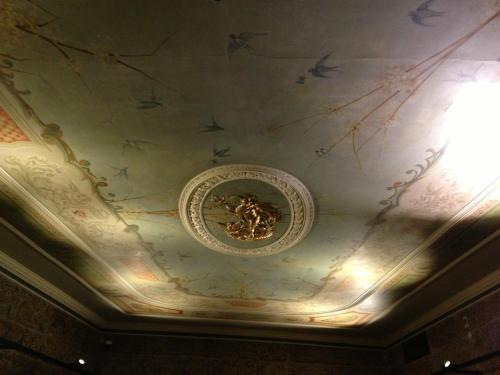 a ceiling with a painting of birds on it at Guimarães Studios Lounge in Guimarães
