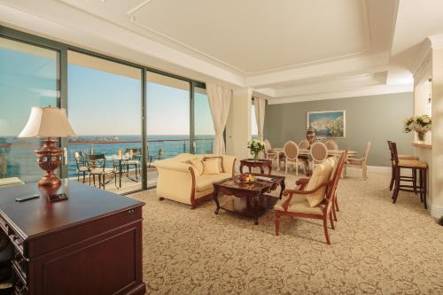 a living room with a couch and a table at Royal Princess Hotel in Dubrovnik