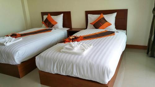 A bed or beds in a room at Baramate Khao Lak - SHA PLUS