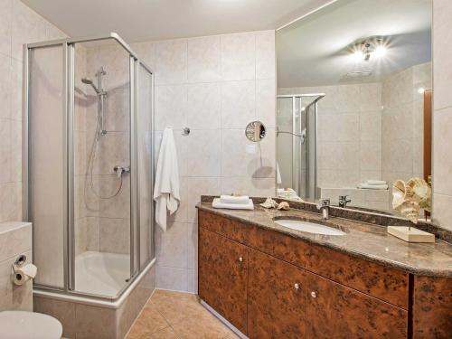 a bathroom with a sink and a shower at Villa Sommerfreude in Bansin