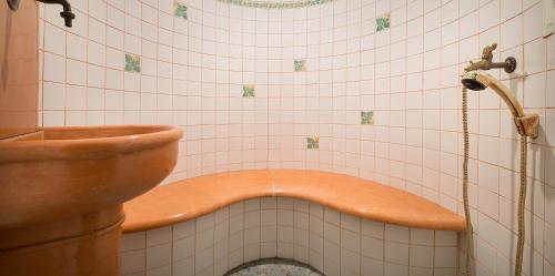 a bath tub in a bathroom with a toilet at Hotel Compagnoni in Livigno