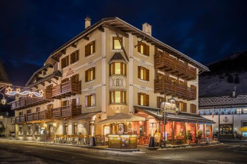 a hotel in the mountains at night at Hotel Compagnoni in Livigno