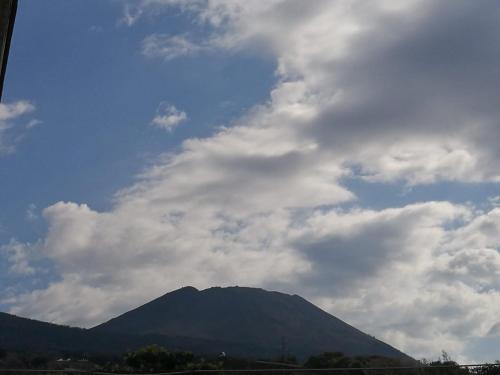 a view of a mountain under a cloudy sky at B&B Incanto in Ercolano