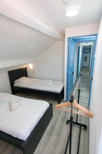 Ένα ή περισσότερα κρεβάτια σε δωμάτιο στο Change The World Hostels - Cascais - Estoril