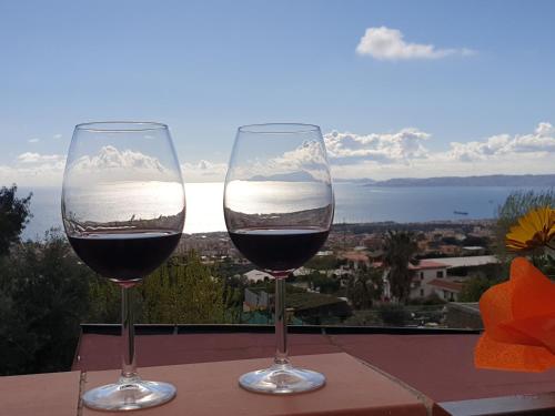 two glasses of wine sitting on top of a table at B&B Incanto in Ercolano