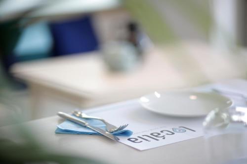 a pair of scissors sitting on top of a table at Zefyros Sea View Hotel in Platamonas
