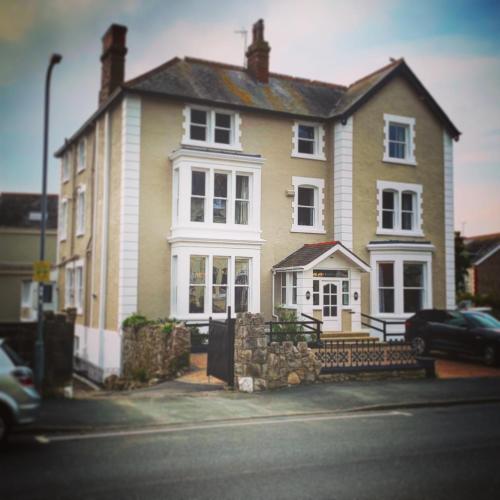 a large house on the side of a street at Lansdowne House with Private Car Park in Llandudno