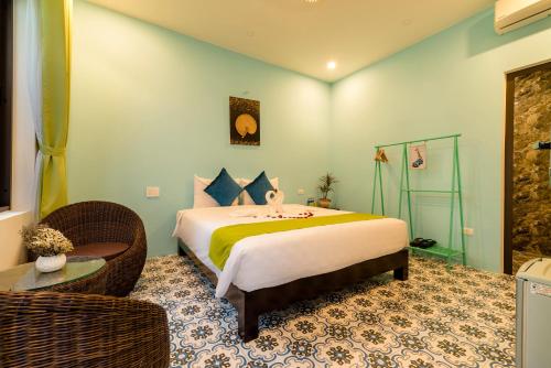 a bedroom with a large bed in a room at Sunny Riverside Homestay in Hoi An