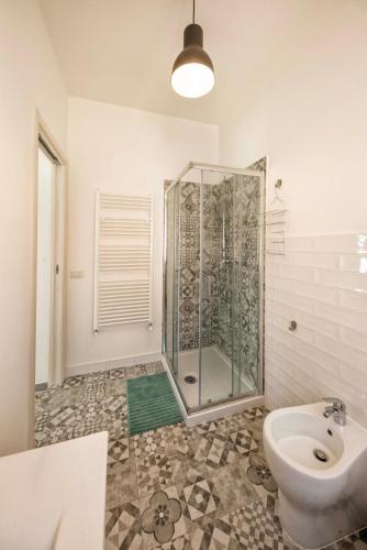 a bathroom with a shower and a toilet and a sink at MADI' casa vacanze in Laiatico
