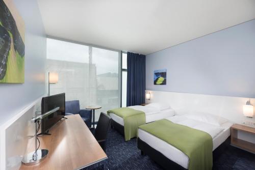 Postel nebo postele na pokoji v ubytování Seminaris CampusHotel Berlin
