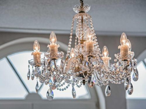 a chandelier hanging from a ceiling at Villa Sommerfreude in Bansin