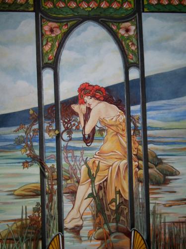 a stained glass window of a woman in the water at Hotel Fiordigigli in Assergi