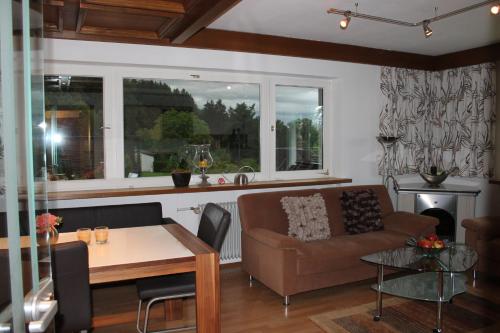 a living room with a couch and a table at Haus Anni in Lochau