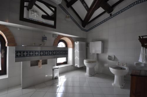 a bathroom with a sink and a toilet and a window at Residenza Scorcio Sul Mare in Porto San Giorgio