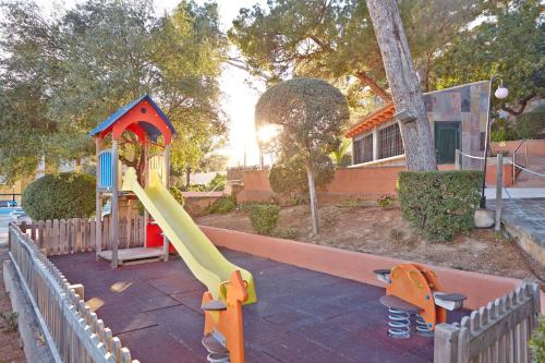 a small playground with a slide at MLL Blue Bay in Palma de Mallorca