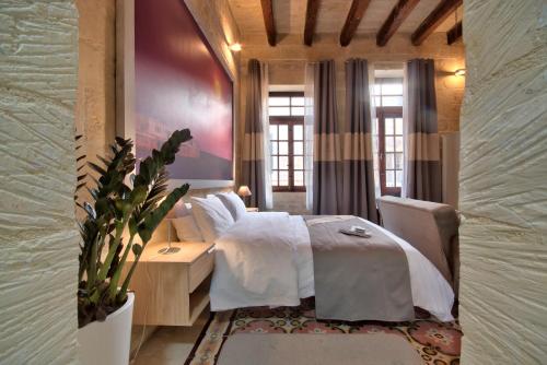 Postel nebo postele na pokoji v ubytování Laparelli Suites: Luxury Suite 3