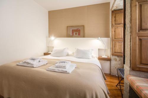 Säng eller sängar i ett rum på Porto Premium River View I