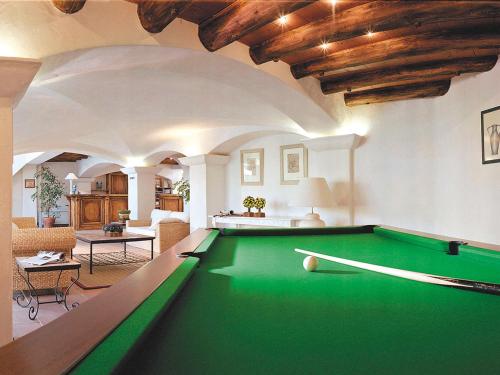 a pool table in the middle of a living room at Lagrange Vacances Port-Marine in Sainte-Maxime