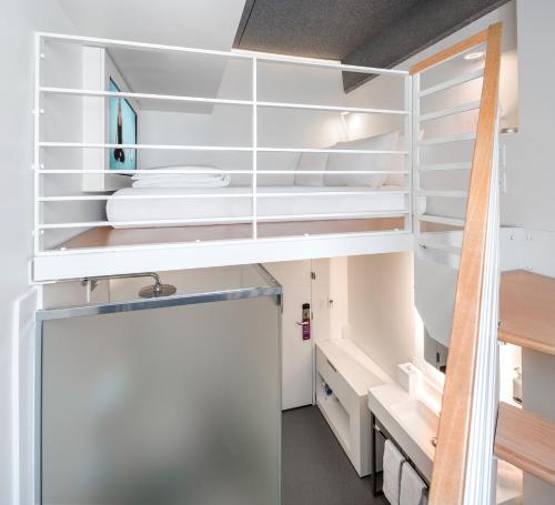 a room with white shelving in a kitchen at Yotel San Francisco in San Francisco
