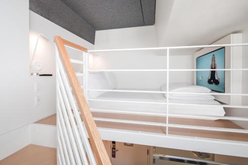 a staircase in a room with white shelves at Yotel San Francisco in San Francisco