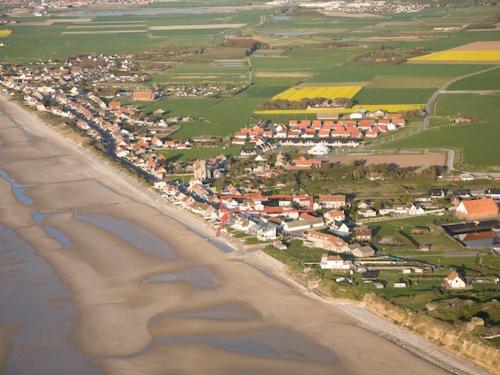 an aerial view of a beach and a town at La Maison Blanche in Sangatte