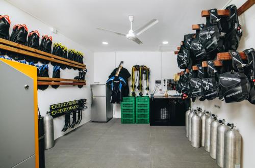 a hockey room with hockey gear and hockey equipment at WAVE SOUND by 3S Maldives in Maradhoofeydhoo