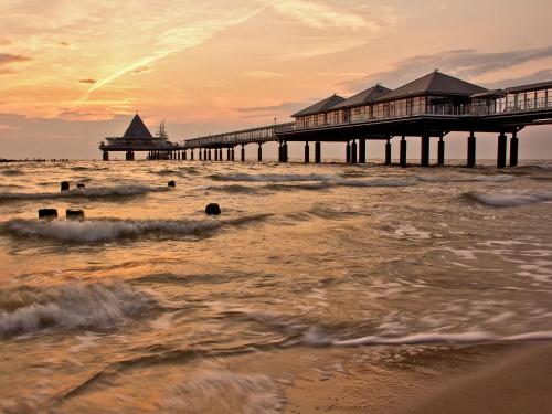a pier on the beach with the ocean at Villa Sommerfreude in Bansin