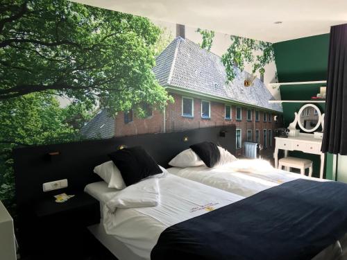 Gulta vai gultas numurā naktsmītnē Hotel Het Wapen van Drenthe