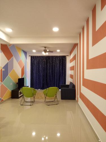 a waiting room with chairs and a window at ICOLOR HOME & STAY CH 8 in Tanah Rata