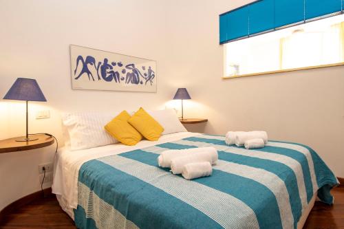 a bedroom with a bed with towels on it at Julia by PortofinoHomes in Portofino