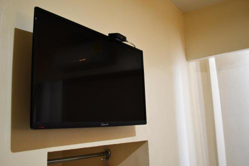 TV a/nebo společenská místnost v ubytování Hotel America Palacio