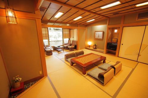 a living room with a couch and a table at Morizuya in Toyooka