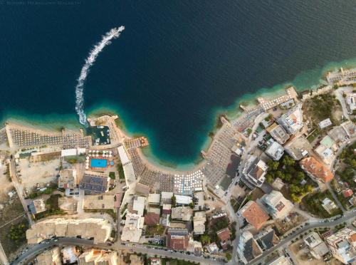 an aerial view of a city next to the water at Epirus Hotel in Sarandë