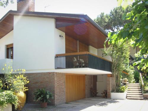 a brick house with a balcony on top of it at Bed And Breakfast 22 Garibaldi Home in Riccione