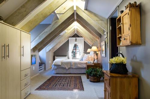 a bedroom with a bed in a attic at The Bergzicht Guest Suite in Cape Town