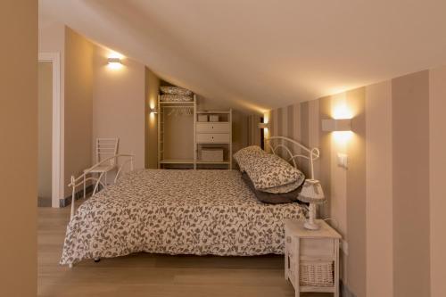Кровать или кровати в номере Merlo d'Oro