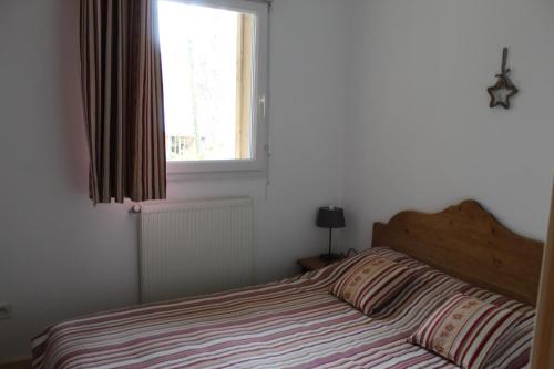 Cama o camas de una habitación en Appartement Nolhan