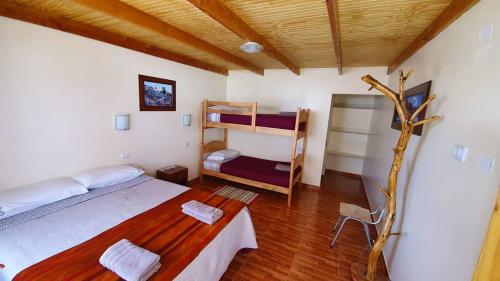 Cama ou camas em um quarto em Hostal Ckamai