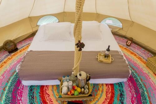 Postel nebo postele na pokoji v ubytování Glamping Finca Corazón