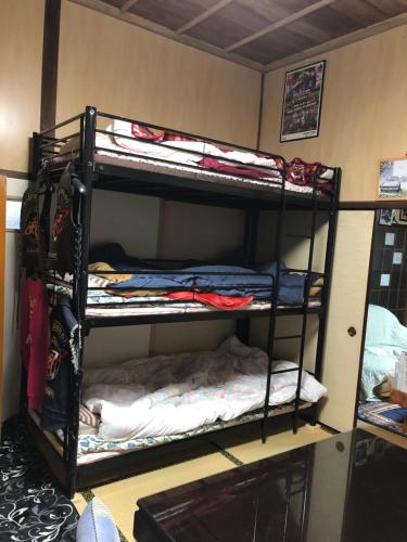 Poschodová posteľ alebo postele v izbe v ubytovaní Rider & Guest House Kazeyoubi