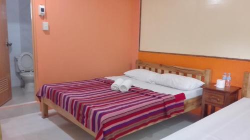 Säng eller sängar i ett rum på Banaue Homestay