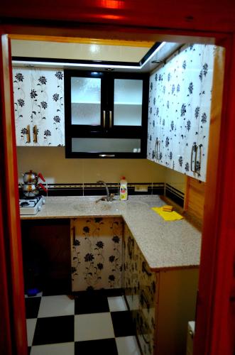 a kitchen with a sink and a window at Ozturk Apart in Uzungöl