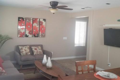 a living room with a couch and a table at Adventure Home Rentals in Phoenix