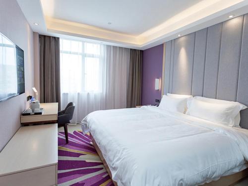Postel nebo postele na pokoji v ubytování Lavande Hotel (Yongxin Bubugao Times Square)