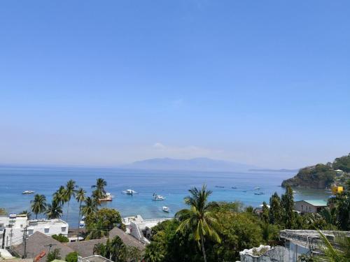 a view of a bay with boats in the water at Manarra Sea View Resort in Puerto Galera