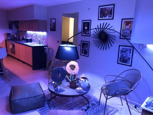 a living room with a table and two chairs at Résidence Nakiya in Sainte-Marie