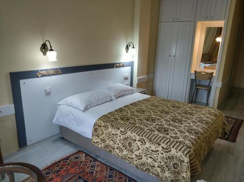 a bedroom with a large bed in a room at Hali Hotel in Istanbul