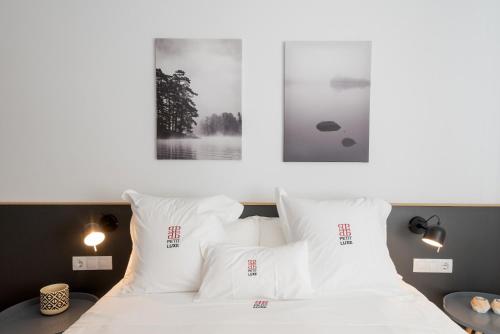Ένα ή περισσότερα κρεβάτια σε δωμάτιο στο Petit Luxe Ègara